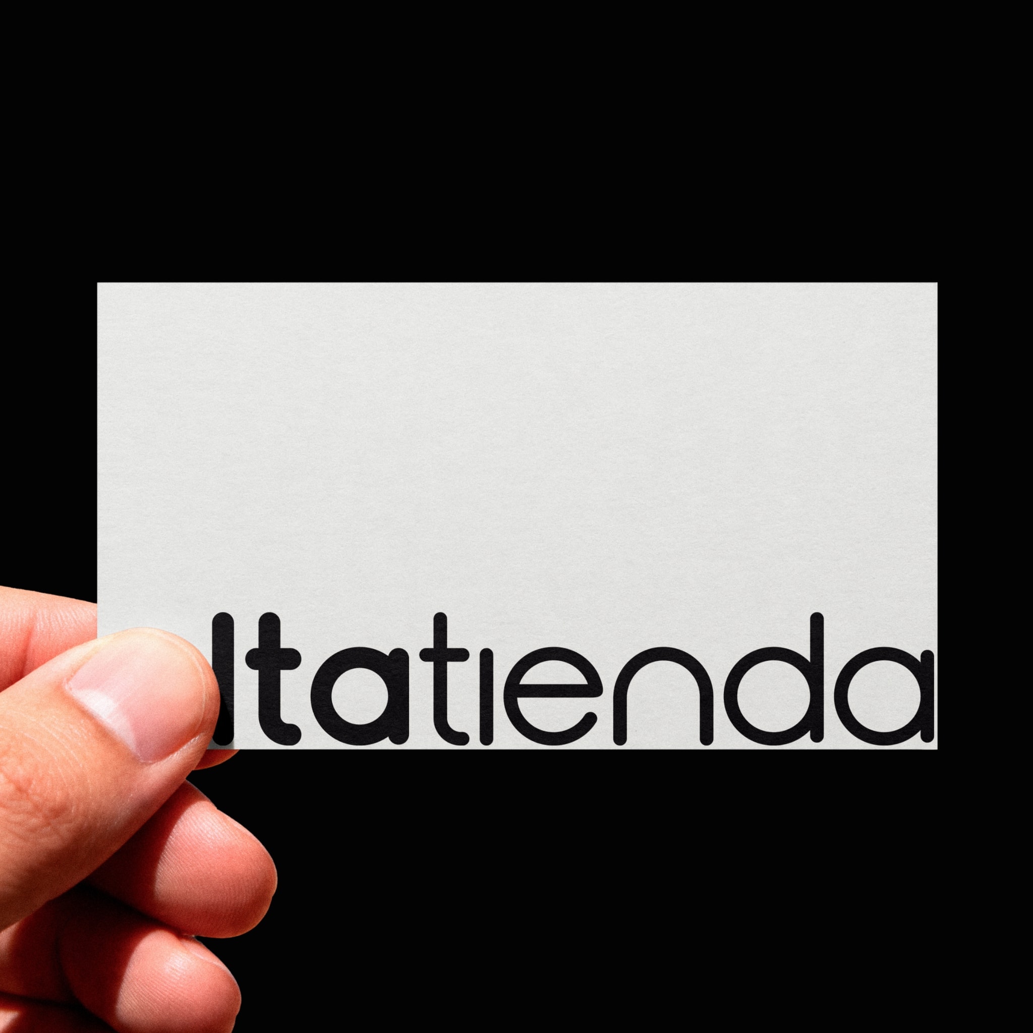 The Altatienda business card, held in a hand