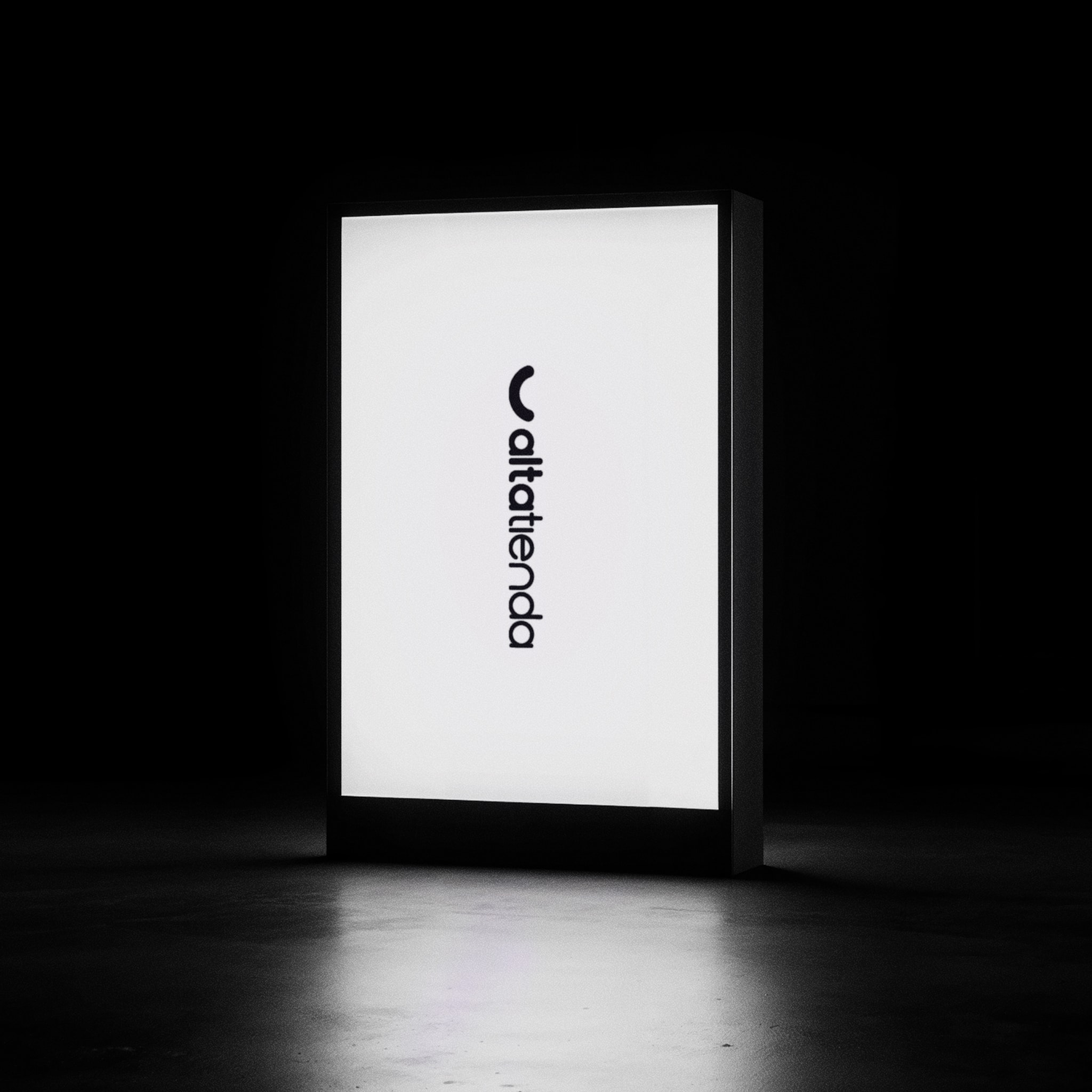 The logo on a lightbox, in the dark