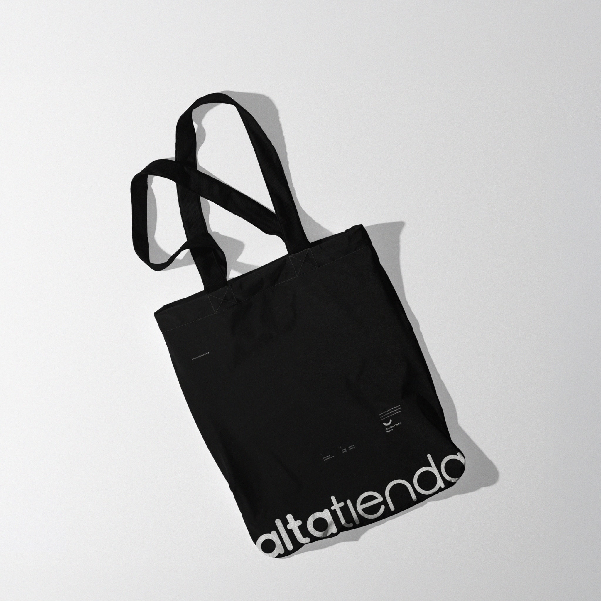 A black fabric bag with the wordmark
