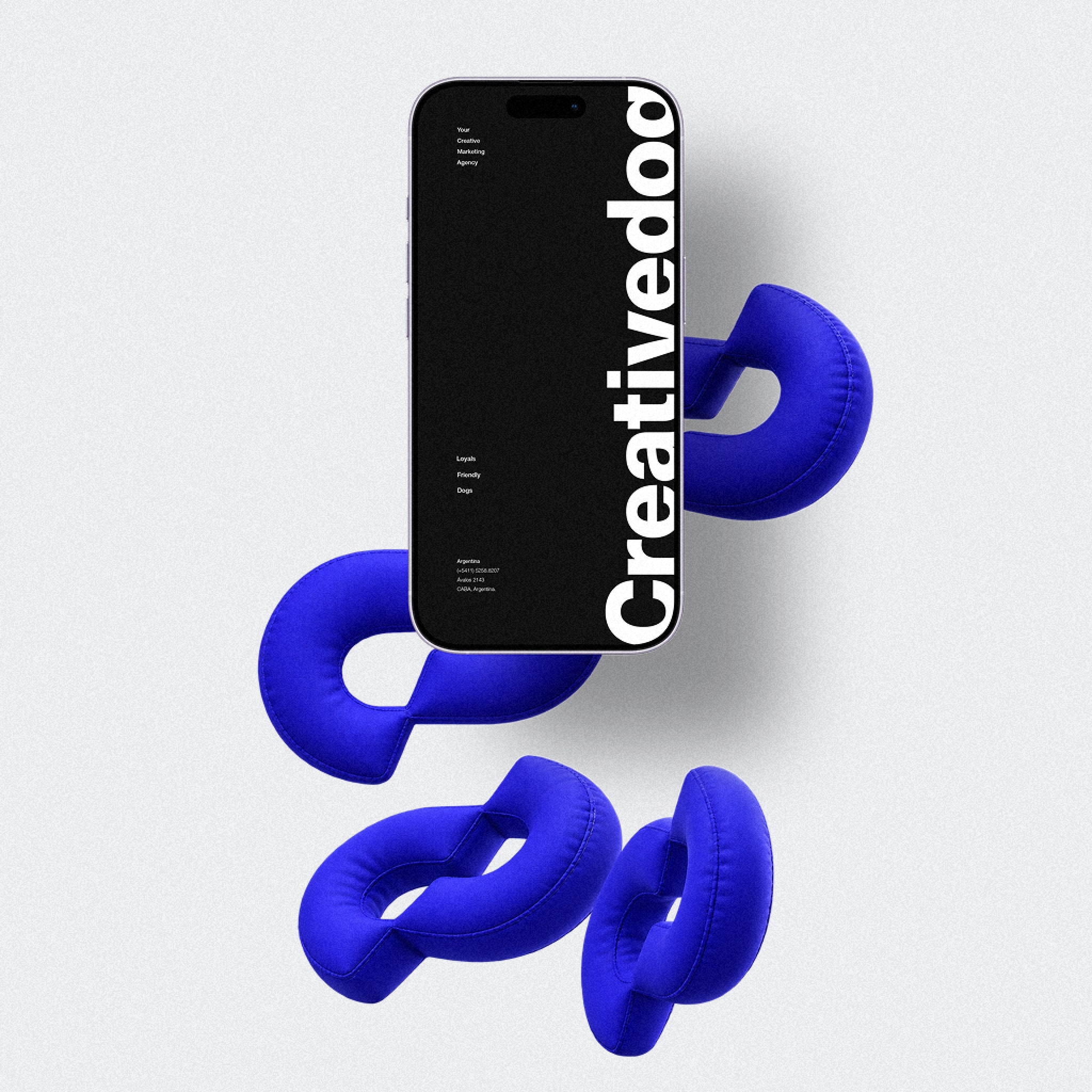 The website on a phone, over inflated monograms
