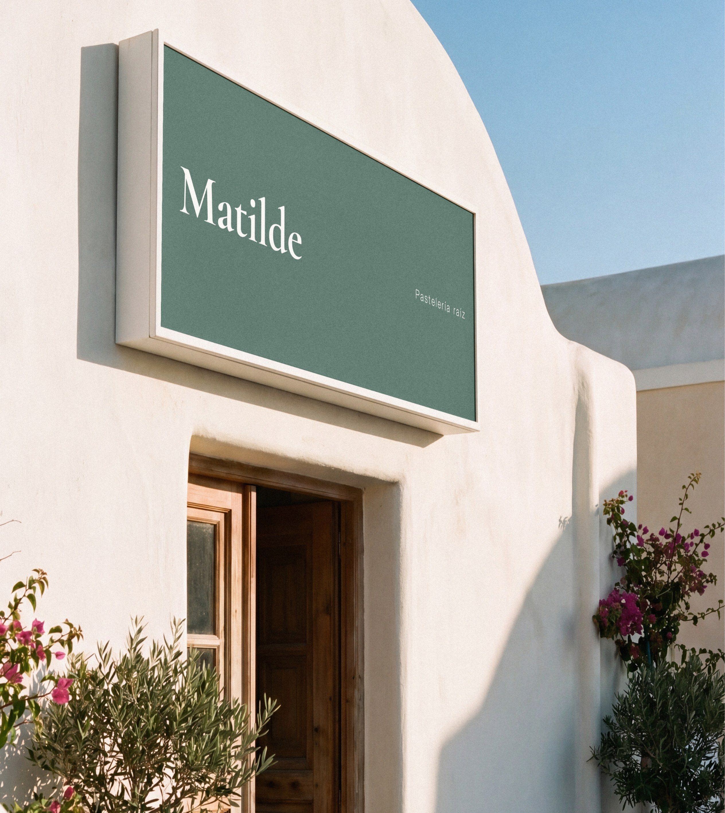 The sign on the façade, above the door
