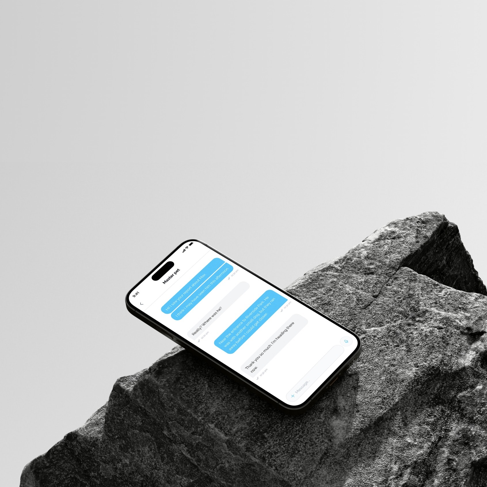 A phone with the chat screen, resting on a stone